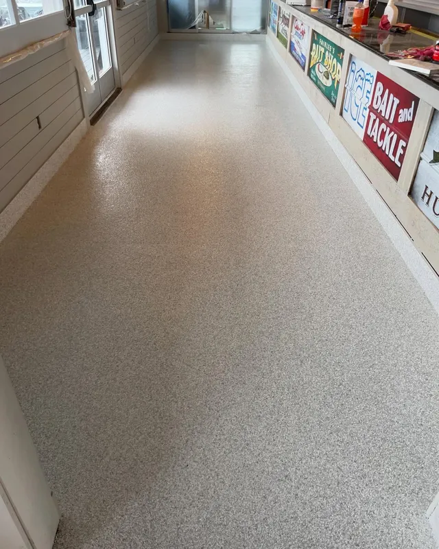 Commercial epoxy flake floor in a tan blend at a bait-and-tackle shop