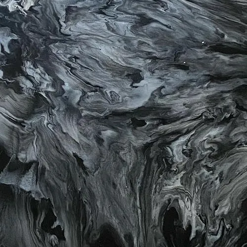 Close-up of a black and silver metallic epoxy surface by Crotti's Painting.