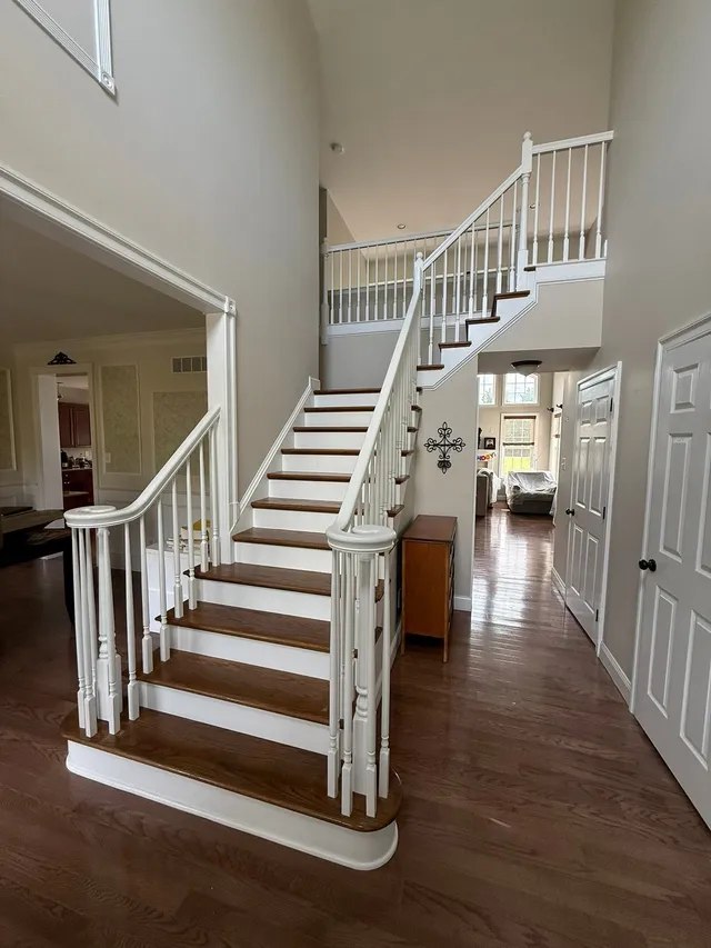 Grand curved staircase after a full refinish, second angle