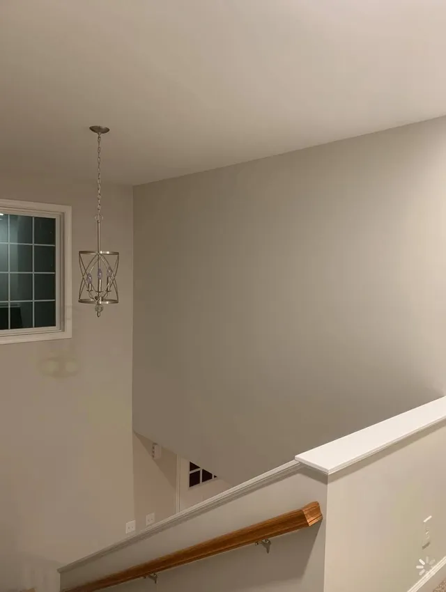 Stairwell with pendant light after an interior paint job